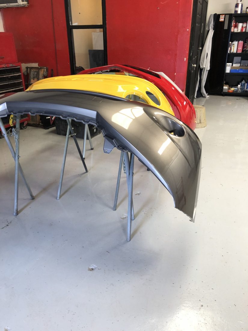 Freshly painted, color-matched body panels at McCoy Enterprises