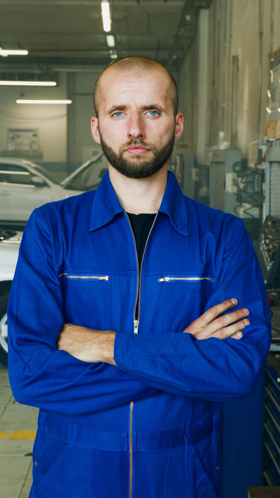 Confident McCoy Enterprises auto mechanic in the Orlando shop