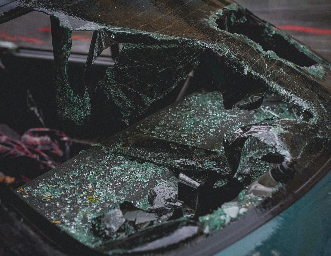 Cracked car windshield being replaced